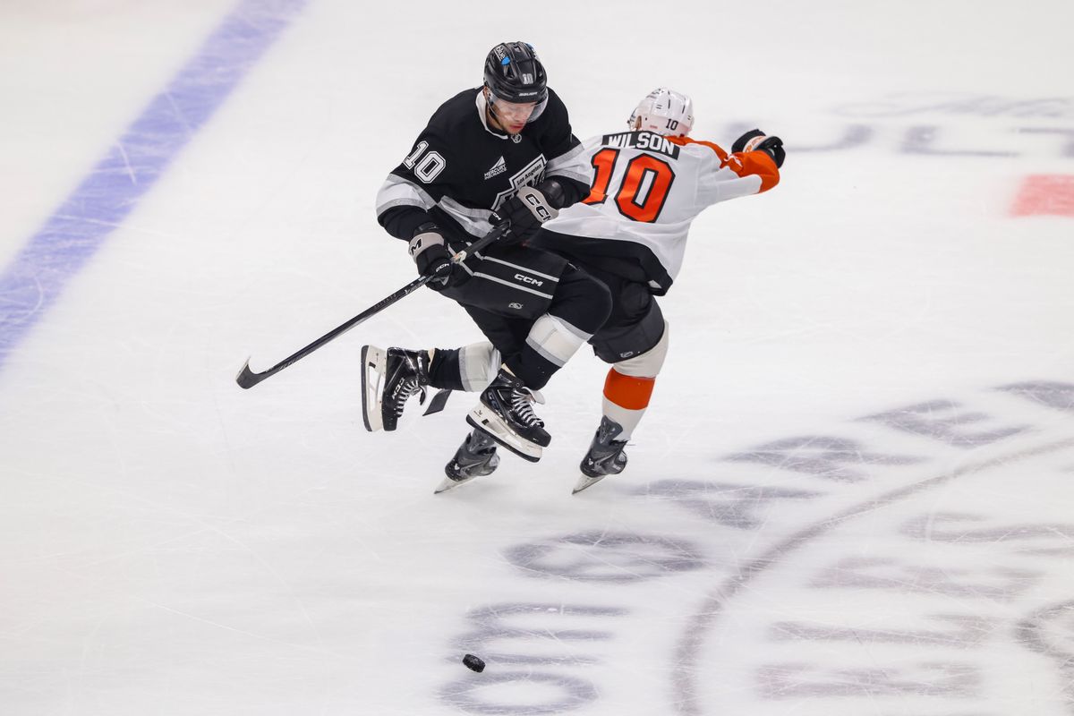 Artemi Panarin #10 of the Los Angeles Kings jumps over the stick of Garrett Wilson #10 of the Philadelphia Flyers during an NHL hockey game, Thursday March 19, 2026 in Los Angeles, Calif.