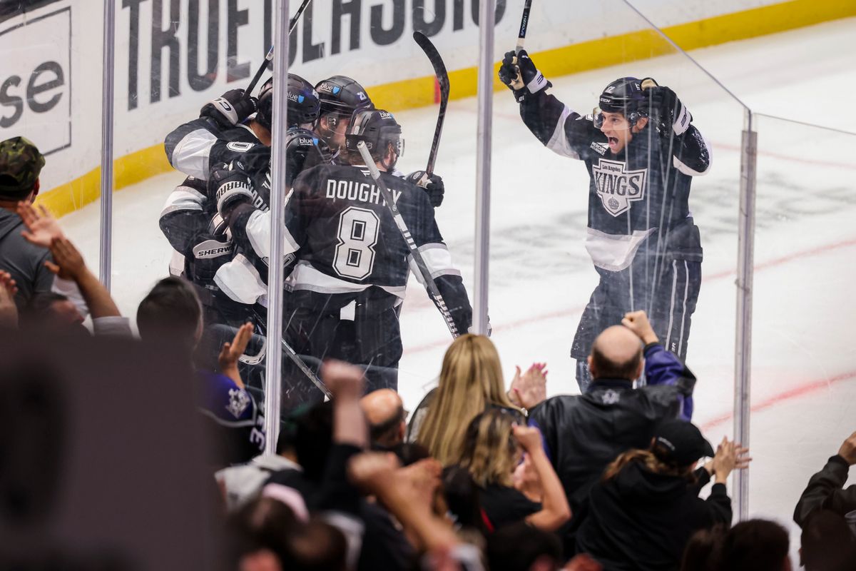 Trevor Moore #12 and Drew Doughty #8 of the Los Angeles Kings celebrate a goal with their teammates during an NHL hockey game against the Philadelphia Flyers, Thursday March 19, 2026 in Los Angeles, Calif.