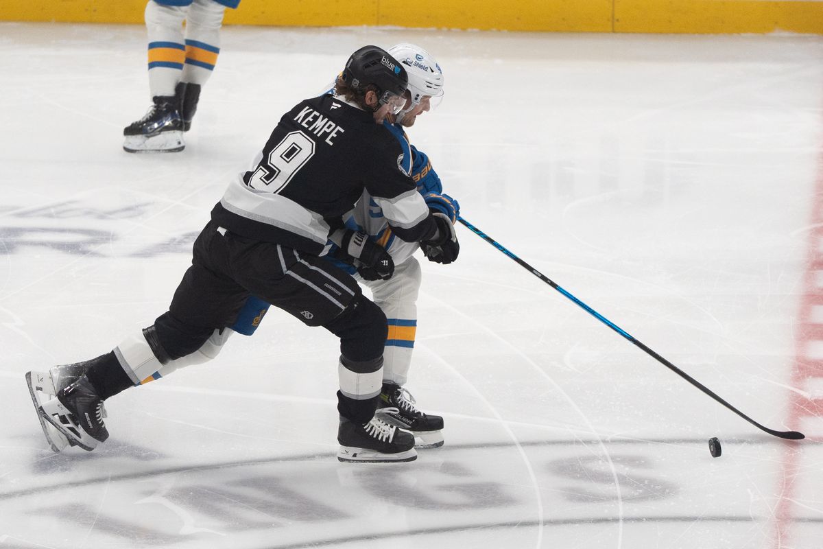 Los Angeles Kings Right Wing Adrian Kempe (9) fights off his opponent for the puckduring an NHL match against the St. Louis Blues on April 1st, 2026 in Los Angeles, California.