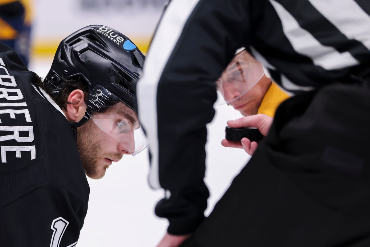Alex Laferriere #14 of the Los Angeles Kings and Erik Haula #56 of the Nashville Predators line up for a face off during an NHL hockey game, Thursday April 2, 2026 in Los Angeles, Calif.