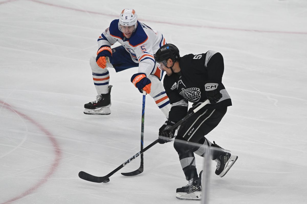 LA Kings defense Cody Ceci (5) controls the puck during an NHL game between the Edmonton Oilers and the Los Angeles Kings on Saturday, April 11, 2026 at Crypto.com Arena in Los Angeles Calif