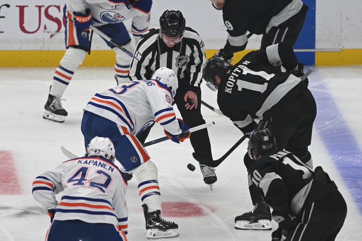 LA Kings center Anze Kopitar (11) faces off with Edmonton Oilers center Ryan Nugent-Hopkins (93) during an NHL game between the Edmonton Oilers and the Los Angeles Kings on Saturday, April 11, 2026 at Crypto.com Arena in Los Angeles Calif