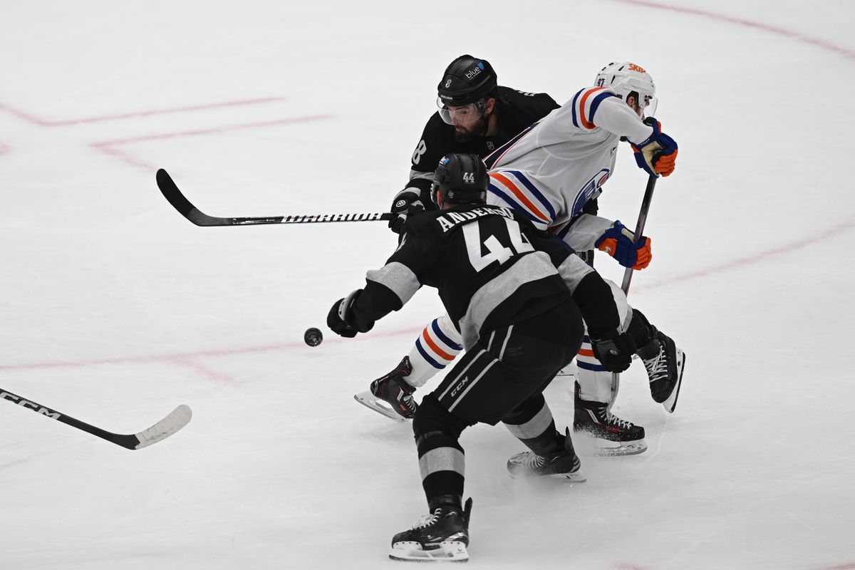 LA Kings defense Mikey Anderson (44) and Drew Doughty (8) takes possession of the puck during an NHL game between the Edmonton Oilers and the Los Angeles Kings on Saturday, April 11, 2026 at Crypto.com Arena in Los Angeles Calif