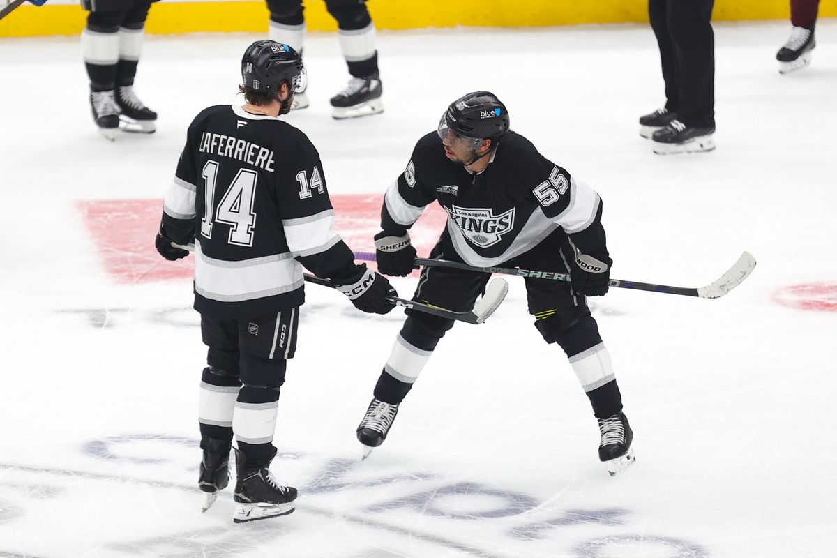 LA Kings right wing Alex Laferriere (14) and right wing Quinton Byfield (55) discuss strategy during an NHL game against the Colorado Avalanche on April 23, 2026 in Los Angeles, CA.