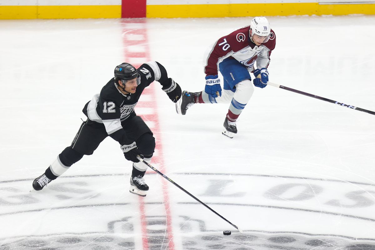 LA Kings left wing Trevor Moore (12) skates with the puck during an NHL game against the Colorado Avalanche on April 23, 2026 in Los Angeles, CA.