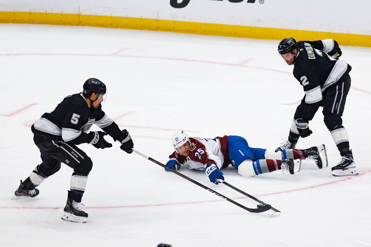 Logan O'Connor #25 of the Colorado Avalanche attempts to defend the puck during an NHL Playoffs game against the Los Angeles Kings on April 26, 2026 at Crypto.com Arena in Los Angeles, California.