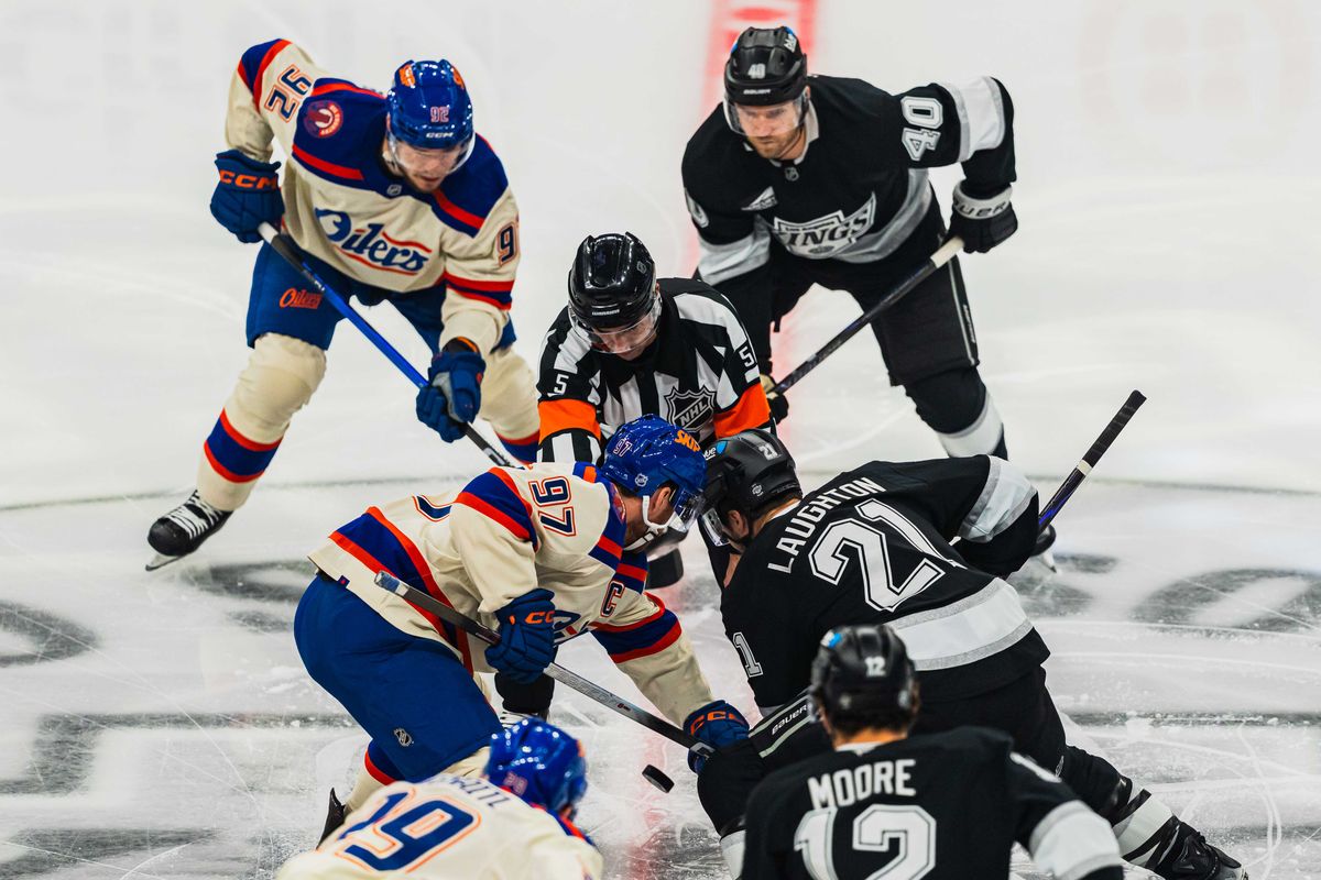 Los Angeles Kings center Scott Laughton (21) faces off during an NHL hockey match against the Edmonton Oilers on October 13th, 2026 in Los Angeles, California. Los Angeles Kings center Scott Laughton (21) faces off during an NHL hockey match against the Edmonton Oilers on October 13th, 2026 in Los Angeles, California.