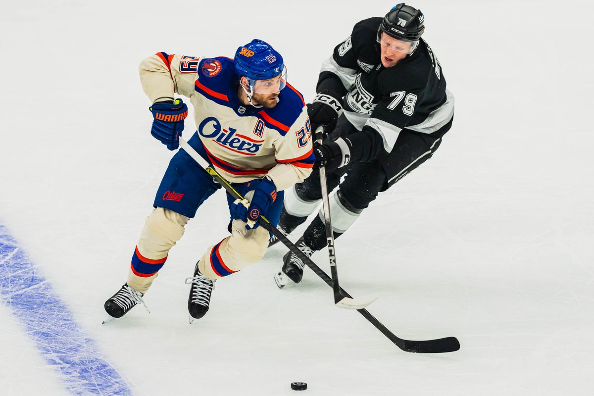 Los Angeles Kings center Samuel Helenius (79) attempts to steal the puck during an NHL hockey match against the Edmonton Oilers on October 13th, 2026 in Los Angeles, California. Los Angeles Kings center Samuel Helenius (79) attempts to steal the puck during an NHL hockey match against the Edmonton Oilers on October 13th, 2026 in Los Angeles, California.