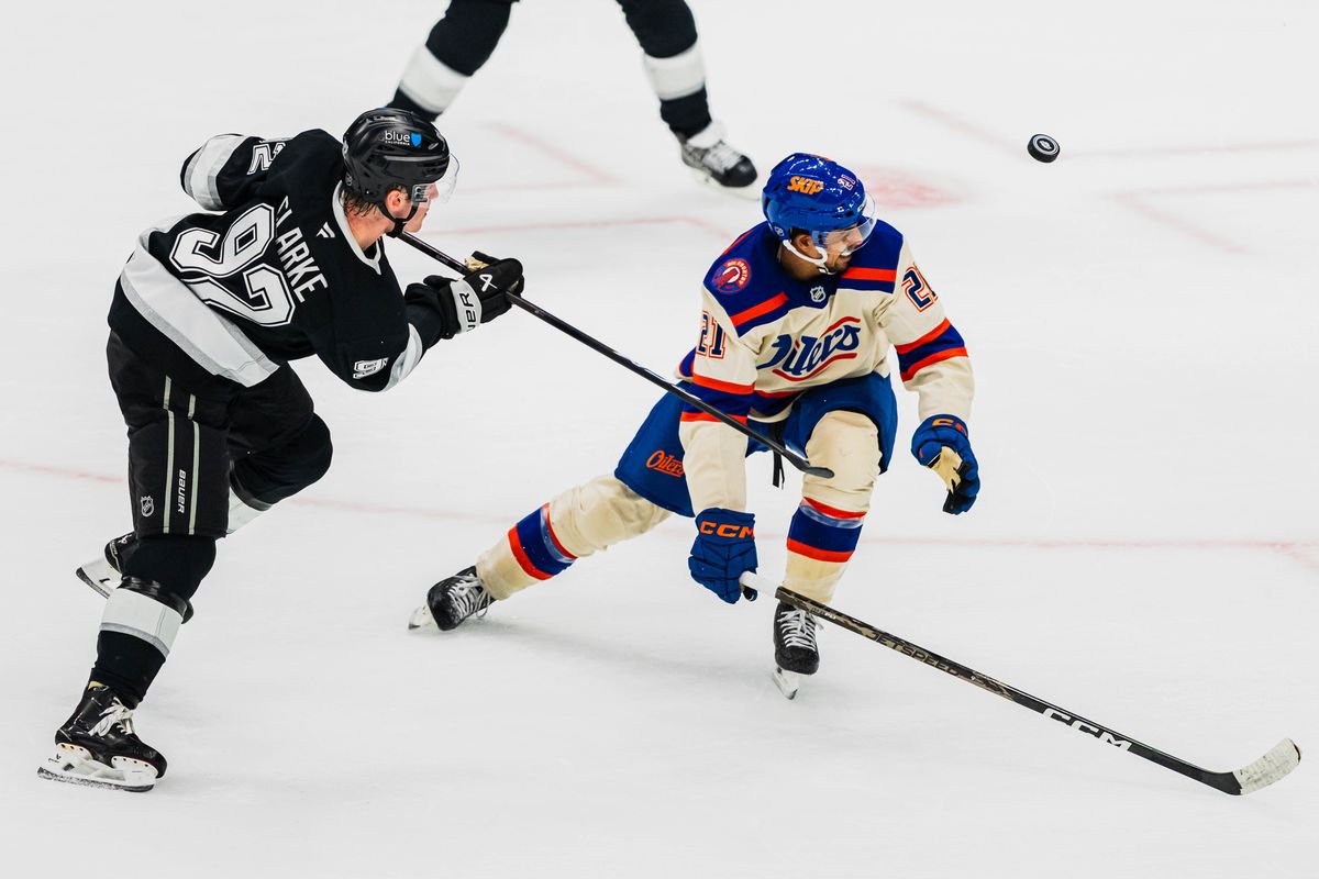 Los Angeles Kings defensemen, Brandt Clark (92) lobs the puck in the air during an NHL hockey match against the Edmonton Oilers on October 13th, 2026 in Los Angeles, California. Los Angeles Kings defensemen, Brandt Clark (92) lobs the puck in the air during an NHL hockey match against the Edmonton Oilers on October 13th, 2026 in Los Angeles, California.