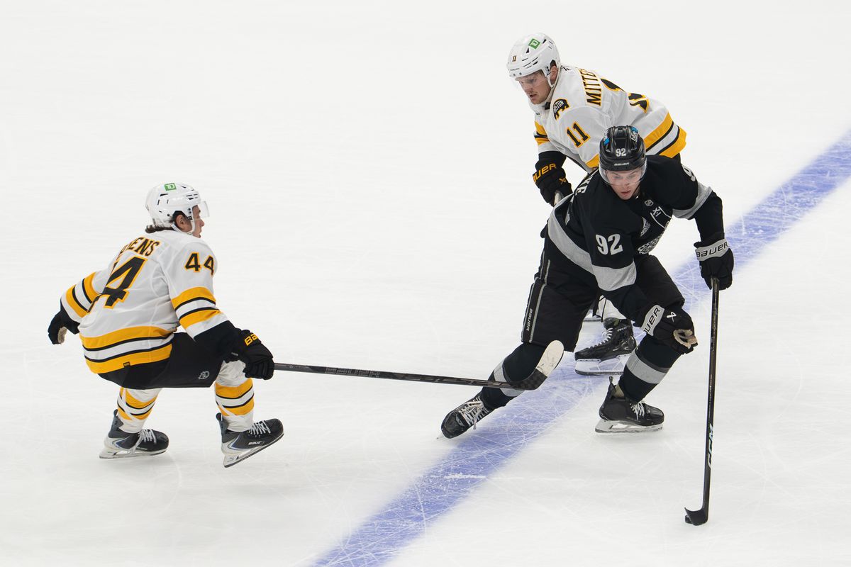 Los Angeles Kings defenseman Brandt Clarke (92) evades a Boston Bruins defender during an NHL game, Saturday, Oct. 17, 2026, at Crypto.com Arena in Los Angeles, California. Los Angeles Kings defenseman Brandt Clarke (92) evades a Boston Bruins defender during an NHL game, Saturday, Oct. 17, 2026, at Crypto.com Arena in Los Angeles, California.