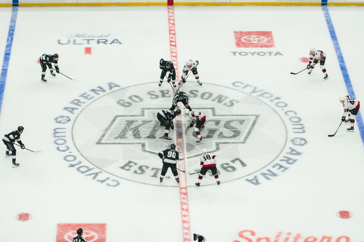 Writing      Los Angeles Kings and Ottawa Senators players face off during a puck drop on October 29, 2026, at Crypto.com Arena in Los Angeles, California.