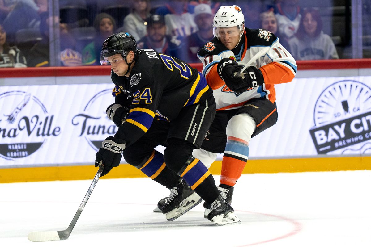 Reign defenseman Angus Booth (24) shields the puck during an AHL hockey game against the Gulls, Wednesday October 14, 2026 in San Diego, California.