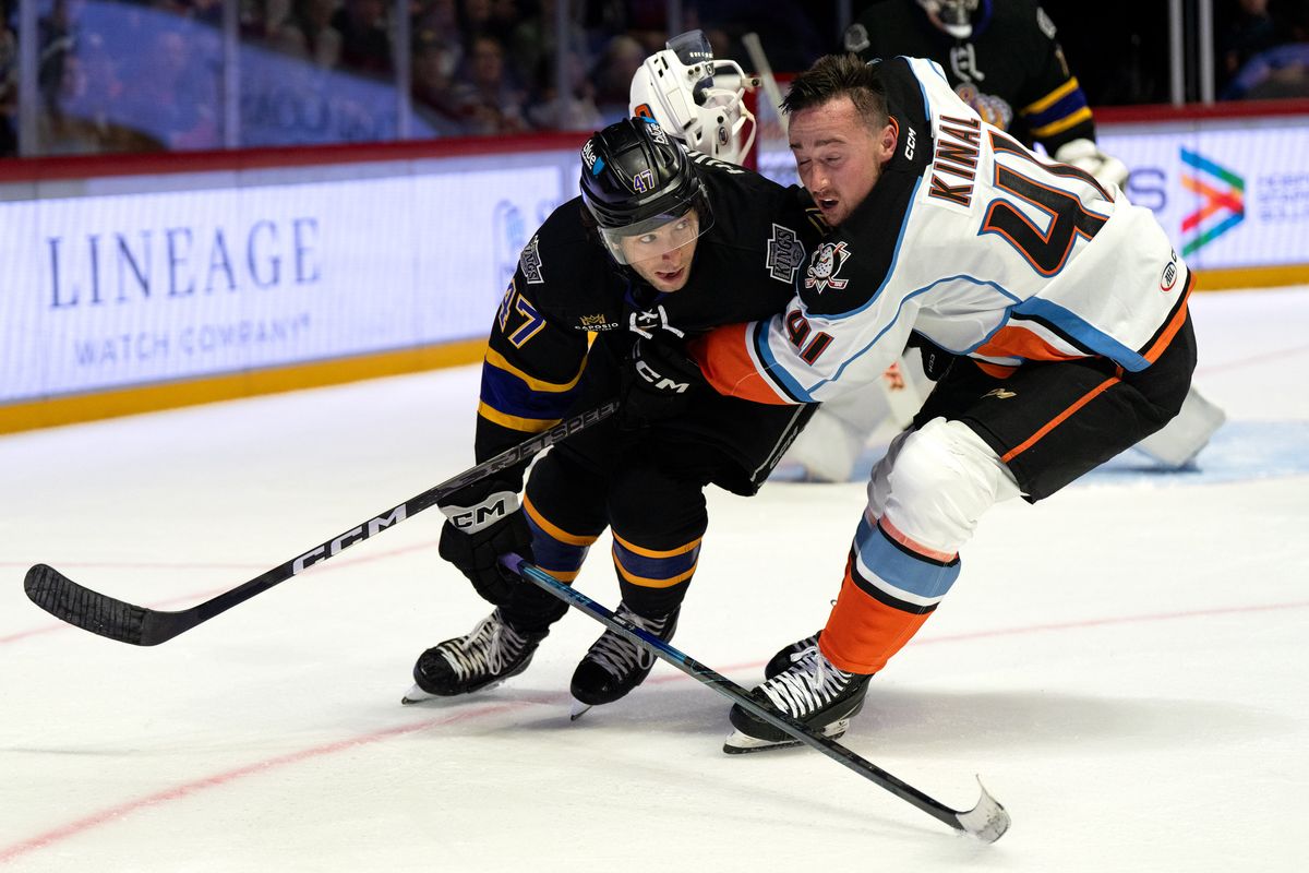 Gulls defenseman Roman Kinal (41) and Reign center Jack Hughes (47) clash during an AHL hockey game, Wednesday October 14, 2026 in San Diego, California.