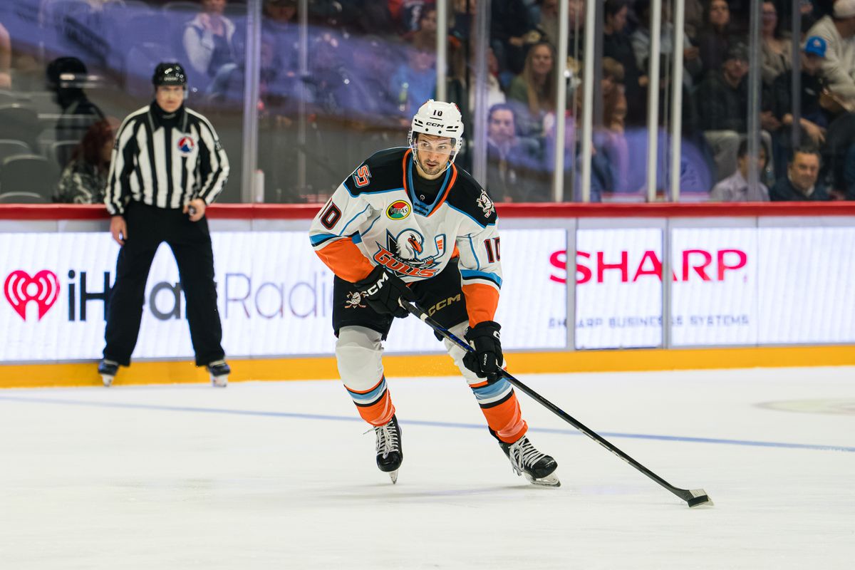 The San Diego Gulls defenseman Travis Mitchell (10) takes the puck up the ice during an AHL hockey game against the Coachella Valley Firebirds on Wednesday, October 21, 2026, at Pechanga Arena in San Diego, California. The San Diego Gulls defenseman Travis Mitchell (10) takes the puck up the ice during an AHL hockey game against the Coachella Valley Firebirds on Wednesday, October 21, 2026, at Pechanga Arena in San Diego, California.