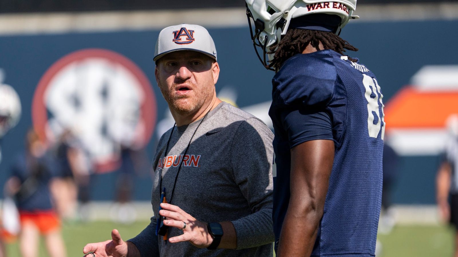 Auburn Tigers head coach Alex Golesh talks with wide receiver Erick Smith (81) during Auburn football practice at Woltosz Football Performance Center in Auburn, Ala. on Saturday, Aug. 8, 2026. Auburn Tigers head coach Alex Golesh talks with wide receiver Erick Smith (81) during Auburn football practice at Woltosz Football Performance Center in Auburn, Ala. on Saturday, Aug. 8, 2026.