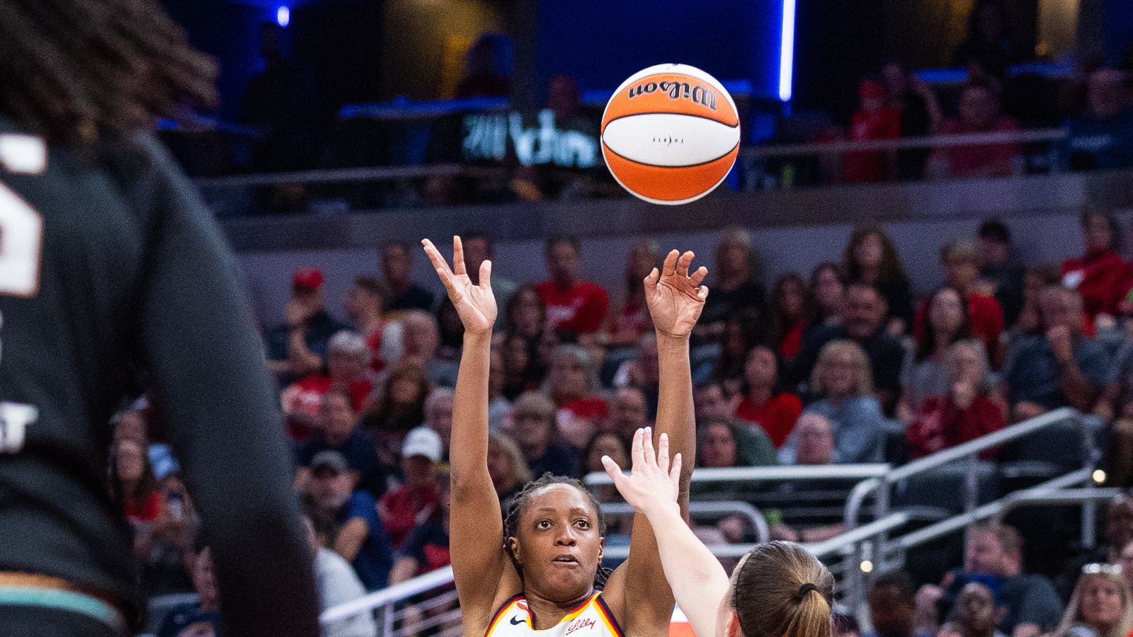 Aug 11, 2026; Indianapolis, Indiana, USA; Indiana Fever guard Kelsey Mitchell (0) shoots the ball while New York Liberty guard Sabrina Ionescu (20) defends in the second half at Gainbridge Fieldhouse. Aug 11, 2026; Indianapolis, Indiana, USA; Indiana Fever guard Kelsey Mitchell (0) shoots the ball while New York Liberty guard Sabrina Ionescu (20) defends in the second half at Gainbridge Fieldhouse.