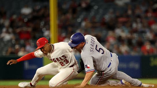Aug 13, 2026; Anaheim, California, USA; Los Angeles Angels shortstop Denzer Guzman (23) tags out Texas Rangers designated hitter Corey Seager (5) at second base to complete a double play during the sixth inning at Angel Stadium. Aug 13, 2026; Anaheim, California, USA; Los Angeles Angels shortstop Denzer Guzman (23) tags out Texas Rangers designated hitter Corey Seager (5) at second base to complete a double play during the sixth inning at Angel Stadium.