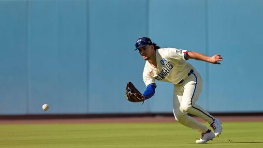 Aug 22, 2026; Los Angeles, California, USA; Los Angeles Dodgers center fielder Alek Thomas (9) fields a single by Pittsburgh Pirates shortstop Jared Triolo (19) during the second inning at Dodger Stadium.
