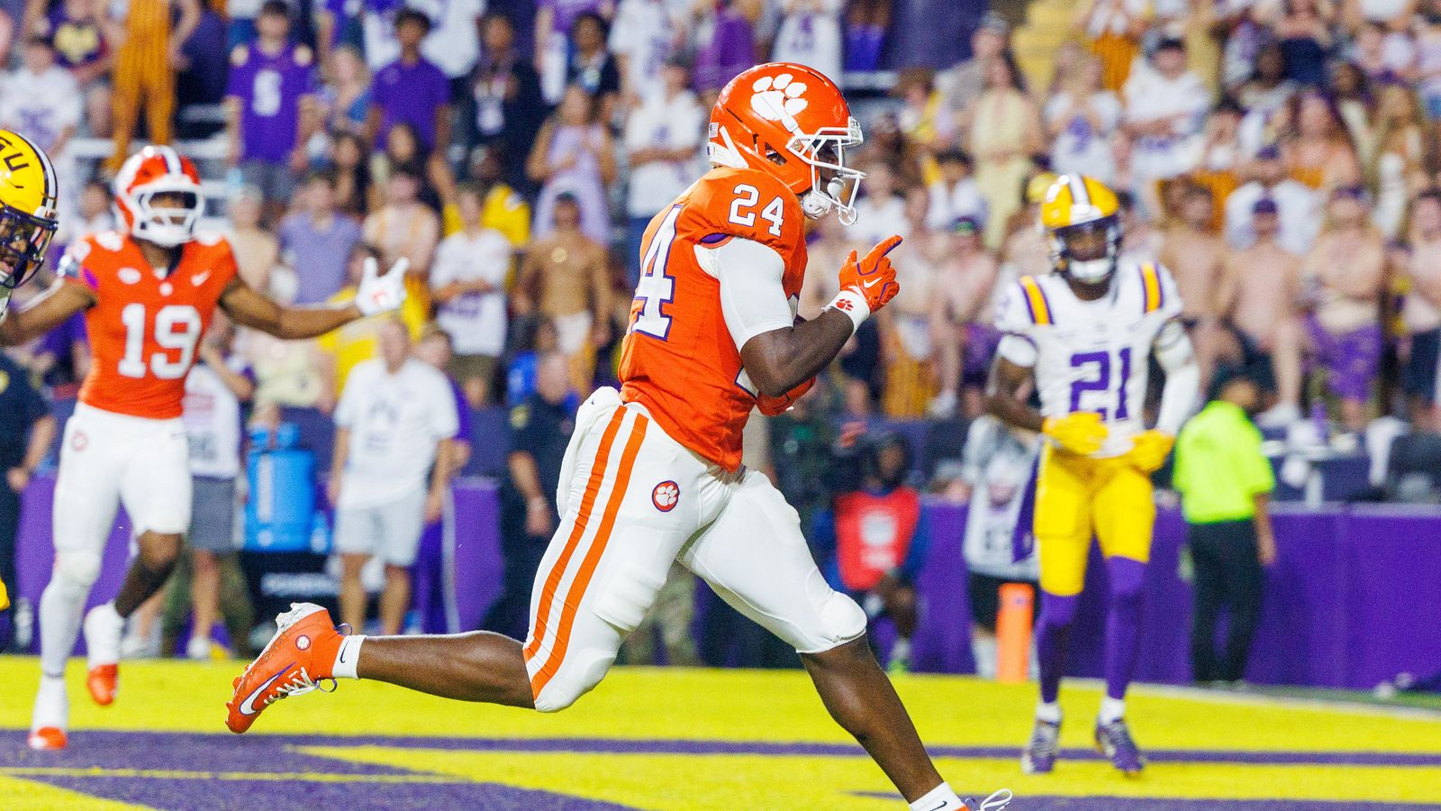 Sep 5, 2026; Baton Rouge, Louisiana, USA; Clemson Tigers running back David Eziomume (24) scores a touchdown against LSU Tigers cornerback Michael Turner Jr. (21) during the second half at Tiger Stadium