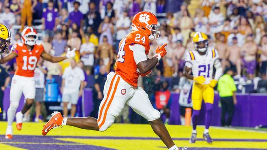 Sep 5, 2026; Baton Rouge, Louisiana, USA; Clemson Tigers running back David Eziomume (24) scores a touchdown against LSU Tigers cornerback Michael Turner Jr. (21) during the second half at Tiger Stadium