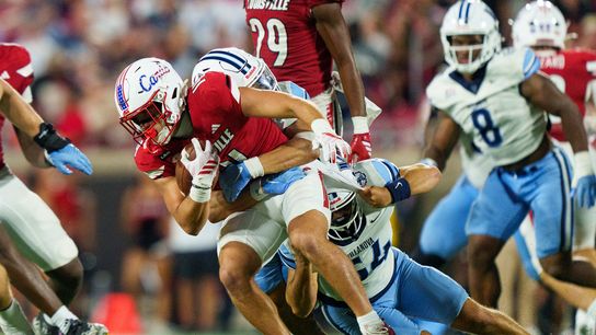 Sep 11, 2026; Louisville, Kentucky, USA; Louisville Cardinals wide receiver Kris Hughes (14) is brought down by the Villanova Wildcats during the game against the Villanova Wildcats at L&N Federal Credit Union Stadium.