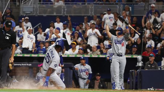 Sep 12, 2026; Miami, Florida, USA; Los Angeles Dodgers right fielder Josue de Paula (95) slides to home plate and scores a run during the ninth inning against the Miami Marlins with Los Angeles Dodgers catcher Will Smith (16) celebrating at loanDepot Park. Sep 12, 2026; Miami, Florida, USA; Los Angeles Dodgers right fielder Josue de Paula (95) slides to home plate and scores a run during the ninth inning against the Miami Marlins with Los Angeles Dodgers catcher Will Smith (16) celebrating at loanDepot Park.