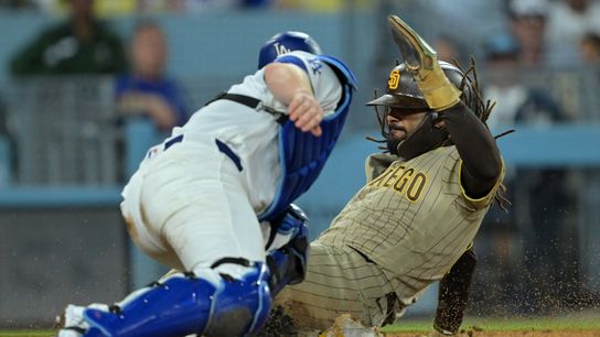 Sep 23, 2026; Los Angeles, California, USA; San Diego Padres right fielder Fernando Tatis Jr. (23) slides under the tag by Los Angeles Dodgers catcher Will Smith (16) in the fifth inning at Dodger Stadium. Sep 23, 2026; Los Angeles, California, USA; San Diego Padres right fielder Fernando Tatis Jr. (23) slides under the tag by Los Angeles Dodgers catcher Will Smith (16) in the fifth inning at Dodger Stadium.