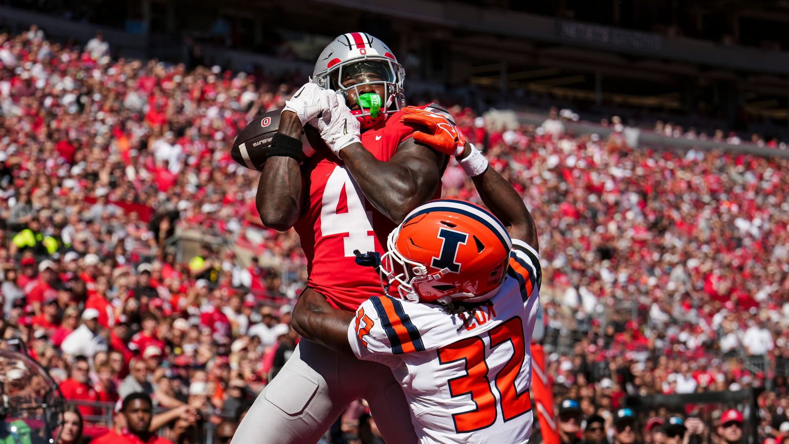 Ohio State Buckeyes wide receiver Jeremiah Smith (4) catches a touchdown over Illinois Fighting Illini defensive back Tywan Cox (32) during the NCAA football game at Ohio Stadium in Columbus on Sept. 26, 2026. Ohio State Buckeyes wide receiver Jeremiah Smith (4) catches a touchdown over Illinois Fighting Illini defensive back Tywan Cox (32) during the NCAA football game at Ohio Stadium in Columbus on Sept. 26, 2026.
