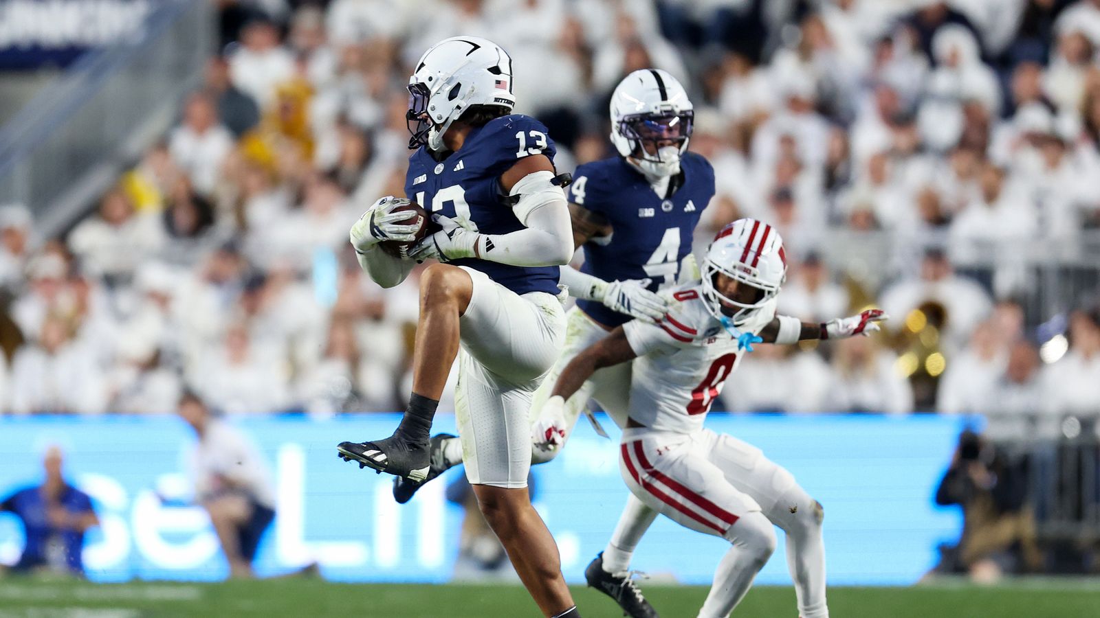 Sep 26, 2026; University Park, Pennsylvania, USA; Penn State Nittany Lions linebacker Tony Rojas (13) intercepts the ball during the fourth quarter against the Wisconsin Badgers at West Shore Home Field at Beaver Stadium. Sep 26, 2026; University Park, Pennsylvania, USA; Penn State Nittany Lions linebacker Tony Rojas (13) intercepts the ball during the fourth quarter against the Wisconsin Badgers at West Shore Home Field at Beaver Stadium.
