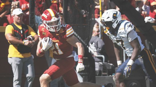Iowa State running back Aiden Flora (21) runs with the ball for a touchdown as West Virginia defensive back Chams Diagnu (7) pursues during the third quarter of a Big 12 Conference football game on Oct. 3, 2026, at Jack Trice Stadium in Ames, Iowa. Iowa State running back Aiden Flora (21) runs with the ball for a touchdown as West Virginia defensive back Chams Diagnu (7) pursues during the third quarter of a Big 12 Conference football game on Oct. 3, 2026, at Jack Trice Stadium in Ames, Iowa.