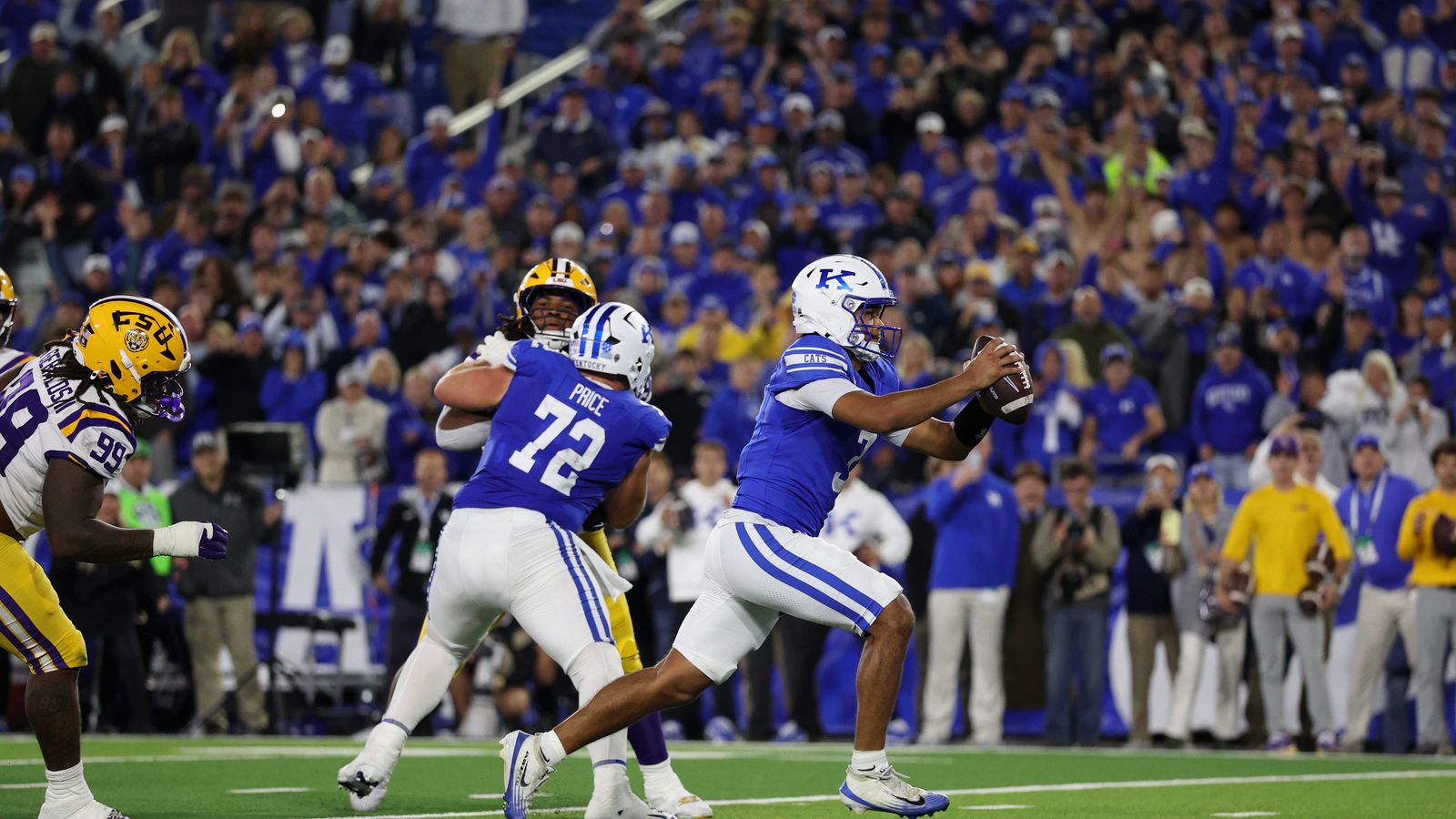 Oct 10, 2026; Lexington, Kentucky, USA; Kentucky Wildcats quarterback Kenny Minchey (3) runs the ball in for a two point conversion to win the game in overtime against the LSU Tigers at Kroger Field. Oct 10, 2026; Lexington, Kentucky, USA; Kentucky Wildcats quarterback Kenny Minchey (3) runs the ball in for a two point conversion to win the game in overtime against the LSU Tigers at Kroger Field.