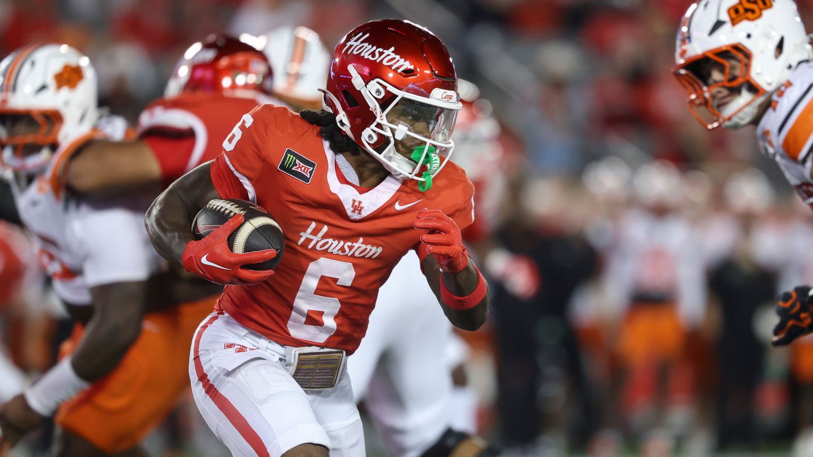 Oct 17, 2026; Houston, Texas, USA; Houston Cougars running back Re'shaun Sanford II (6) runs with the ball during the third quarter against the Oklahoma State Cowboys at TDECU Stadium. Oct 17, 2026; Houston, Texas, USA; Houston Cougars running back Re'shaun Sanford II (6) runs with the ball during the third quarter against the Oklahoma State Cowboys at TDECU Stadium.