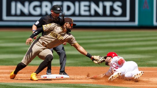 Nolan Schanuel #18 of the Los Angeles Angels slides into second base against Fernando Tatis Jr. #23 of the San Diego Padres during the game at Angel Stadium of Anaheim on April 19, 2026 in Anaheim, California.