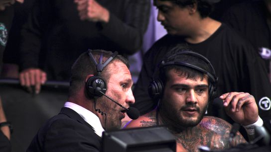 Jesse Sparks (left) sits at LXF commentary desk after finishing Albert Mendoza 