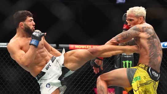 Apr 13, 2024; Las Vegas, Nevada, USA; Arman Tsarukyan (blue gloves) fights Charles Oliveira (red gloves) during UFC 300 at T-Mobile Arena.