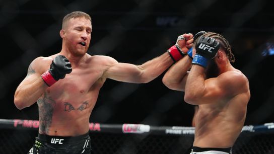 Mar 8, 2025; Las Vegas, Nevada, USA; Justin Gaethje (red gloves) fights Rafael Fiziev (blue gloves) during UFC 313 at T-Mobile Arena.