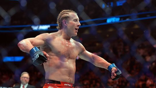 Apr 12, 2025; Miami, Florida, UNITED STATES; Paddy Pimblett (blue gloves) reacts after defeating Michael Chandler (not pictured) during UFC 314 at Kaseya Center.