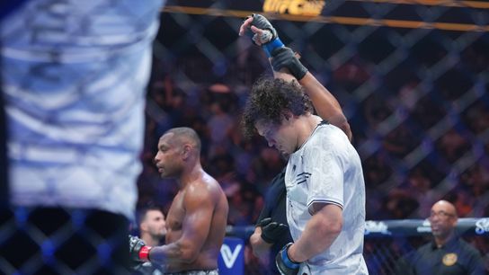 Jun 1, 2024; Newark, New Jersey, USA; Roman Kopylov (blue gloves) celebrates defeating Cesar Almeida (red gloves) during UFC 302 at Prudential Center.