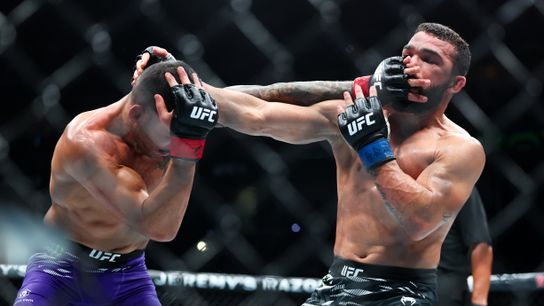 Jul 19, 2025; New Orleans, Louisiana, UNITED STATES; Dan Ige (red gloves) fights against Patricio Pitbull (blue gloves) during UFC 318 at Smoothie King Center.