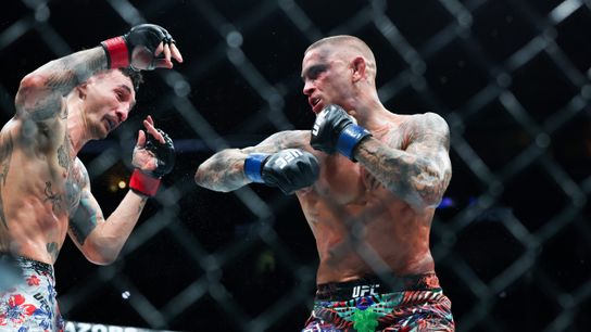 Jul 19, 2025; New Orleans, Louisiana, UNITED STATES; Max Holloway (red gloves) fights against Dustin Poirier (blue gloves) during UFC 318 at Smoothie King Center.