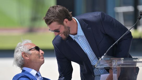 Sandy Koufax shakes hands with Los Angeles Dodgers starting pitcher Clayton Kershaw (22) after speaking during the unveiling ceremony of a brand new Koufax commemorative statue at the Centerfield Plaz... 