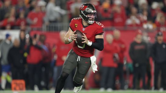 Jan 12, 2025; Tampa, Florida, USA; Tampa Bay Buccaneers quarterback Baker Mayfield (6) rolls out during the first quarter of a NFC wild card playoff against the Washington Commanders at Raymond James Stadium. 