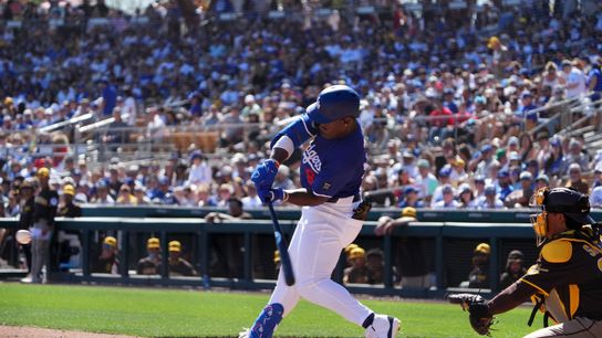 Feb 23, 2025; Phoenix, Arizona, USA; Los Angeles Dodgers right fielder Zyhir Hope (94) hits an RBI against the San Diego Padres during the second inning at Camelback Ranch-Glendale. 
