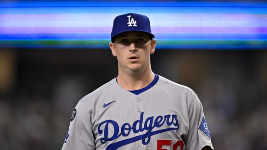 Los Angeles Dodgers relief pitcher Evan Phillips (59) comes off the field during the game between the Texas Rangers and the Los Angeles Dodgers at Globe Life Field. 
