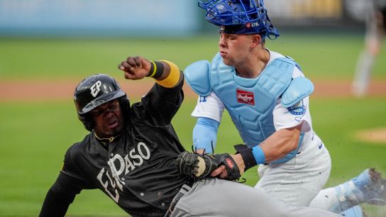El Paso infielder Yonathan Perlaza (5) attempts to steal home and is tagged out by Oklahoma City catcher Dalton Rushing (21) during the home opener Minor League baseball game between the Oklahoma City... 