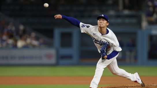 Los Angeles Dodgers pitcher Yoshinobu Yamamoto (18) throws during the fifth inning against the Athletics at Dodger Stadium. 