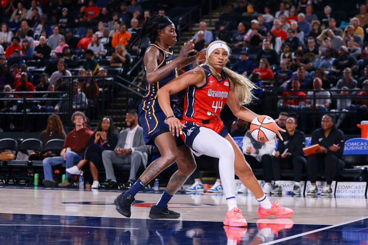 May 28, 2025; Washington, District of Columbia, USA; Washington Mystics forward Kiki Iriafen (44) dribbles the ball while Indiana Fever forward Natasha Howard (6) defends in the second half at Entertainment & Sports Arena. May 28, 2025; Washington, District of Columbia, USA; Washington Mystics forward Kiki Iriafen (44) dribbles the ball while Indiana Fever forward Natasha Howard (6) defends in the second half at Entertainment & Sports Arena.