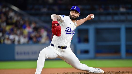 Los Angeles Dodgers pitcher Tanner Scott (66) throws against the New York Mets during the tenth inning at Dodger Stadium. 