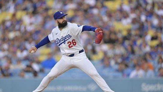 Los Angeles Dodgers pitcher Tony Gonsolin (26) delivers a pitch during the first inning against the New York Mets at Dodger Stadium.