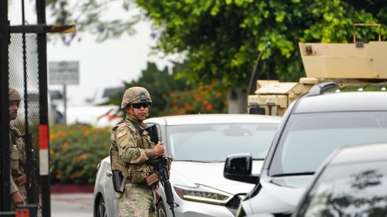 Members of the California National Guard acting under the authority of President Donald Trump guard the entrance to Paramount Business Center on June 9, 2025, in Paramount, California. Protests broke out several days earlier in response to ICE immigration raids at area businesses, and protesters tried to access the business park where ICE has a facility, community members said. Members of the California National Guard acting under the authority of President Donald Trump guard the entrance to Paramount Business Center on June 9, 2025, in Paramount, California. Protests broke out several days earlier in response to ICE immigration raids at area businesses, and protesters tried to access the business park where ICE has a facility, community members said.